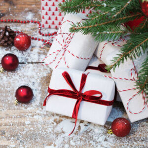 Gifts under artificial christmas tree