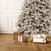 artificial christmas tree, white tree snow fraiser. Up close present gift image.